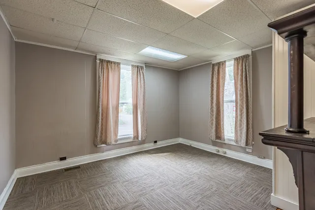 a view of an empty room with a window