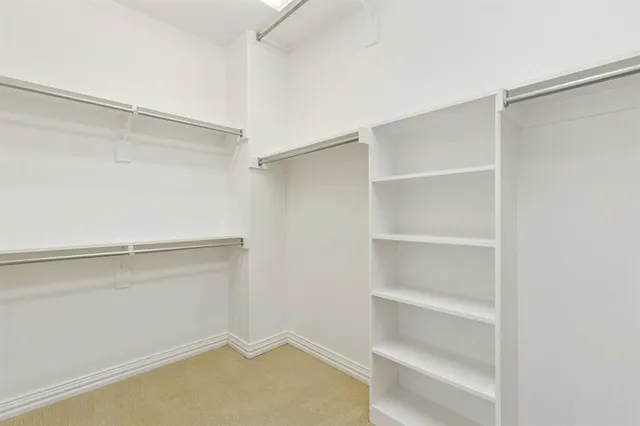 a view of an empty walk in closet