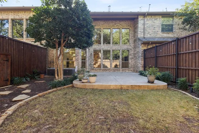 a view of yard with large trees