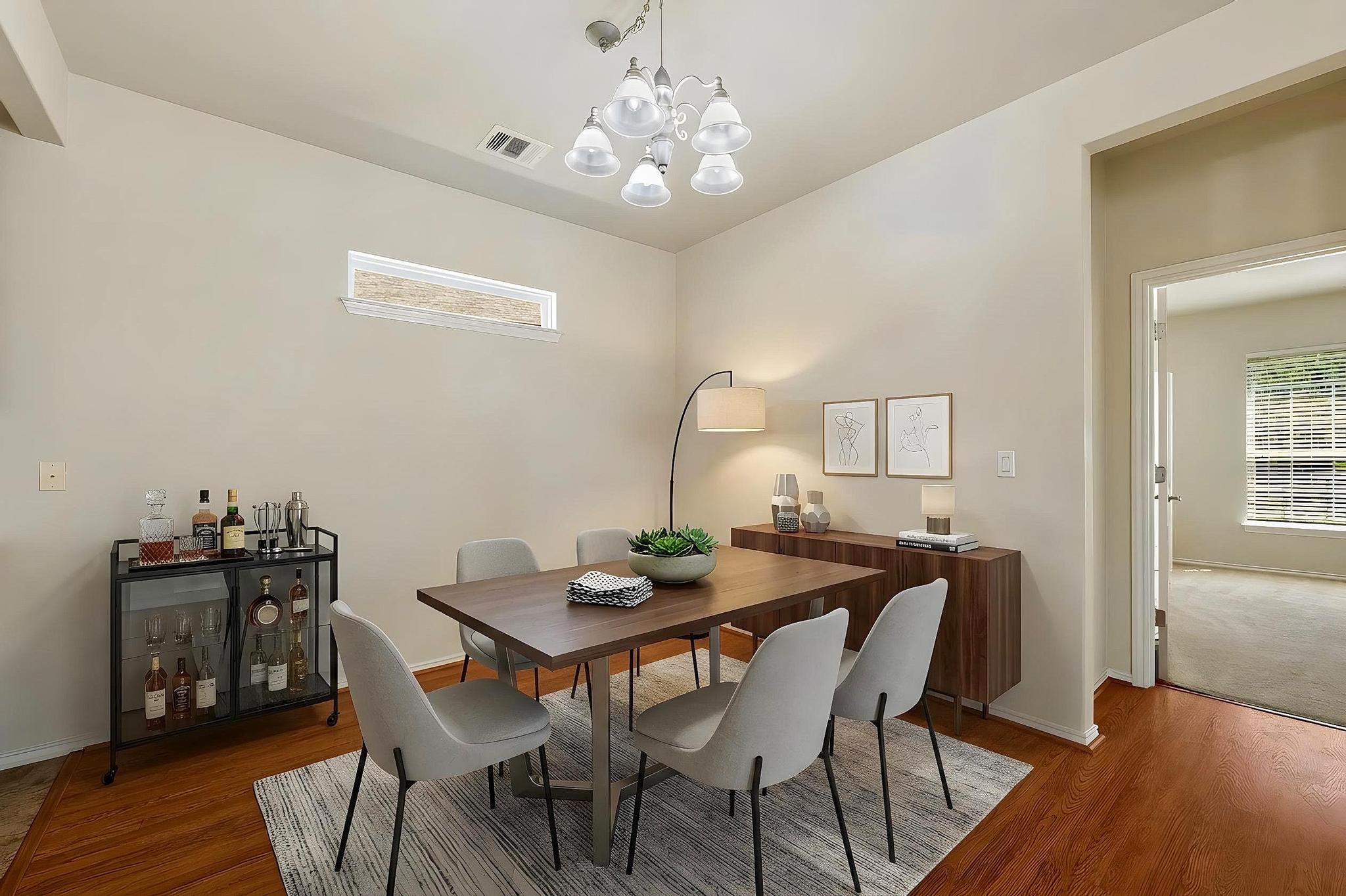 520 Mill Pond Path Georgetown, TX 78633 - Photo 21 of 38 Hardwood flooring extends throughout this naturally illuminated dining space, ideal for memorable gatherings. (Virtually staged)