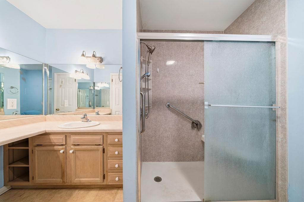 483 Allgood Road Flintstone, GA 30725 - Photo 12 of 34 a bathroom with a shower sink vanity and mirror