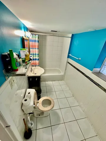 a bathroom with a sink and mirror