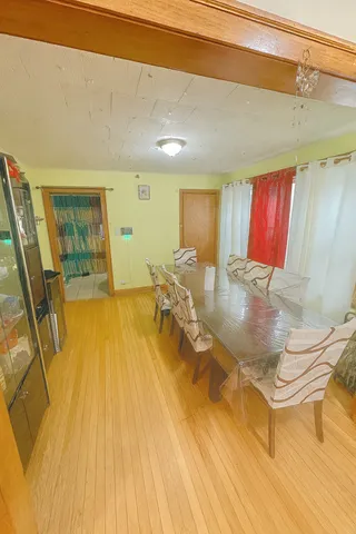 a indoor swimming pool with a glass door shower and couch