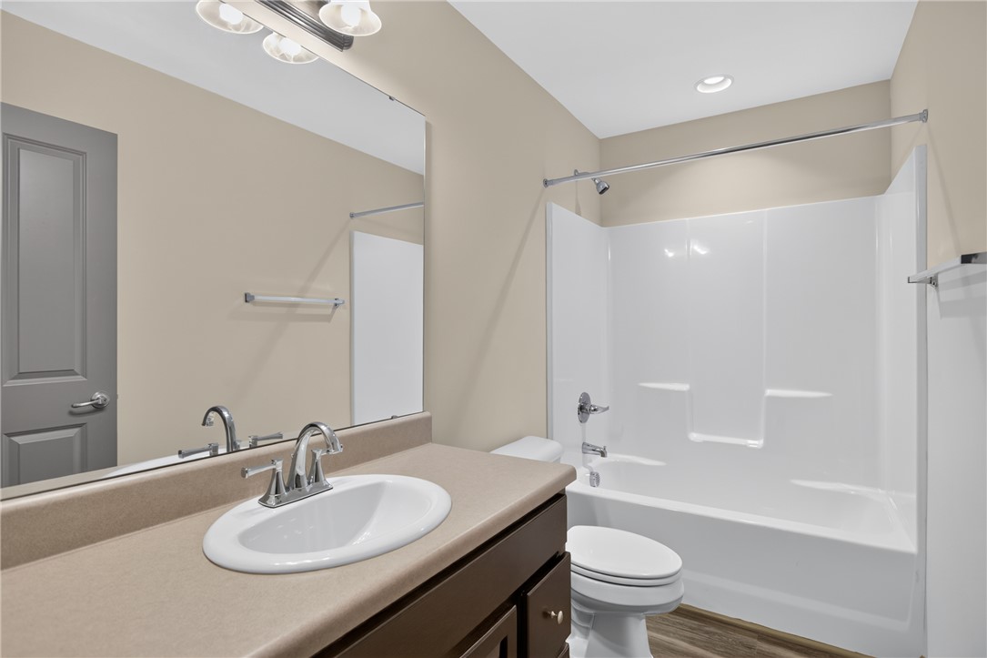 235 Pendleton Road, Unit K1 Clemson, SC 29631 - Photo 32 of 49 A well-lit bathroom features a functional vanity with ample counter space and a classic tub/shower combination.