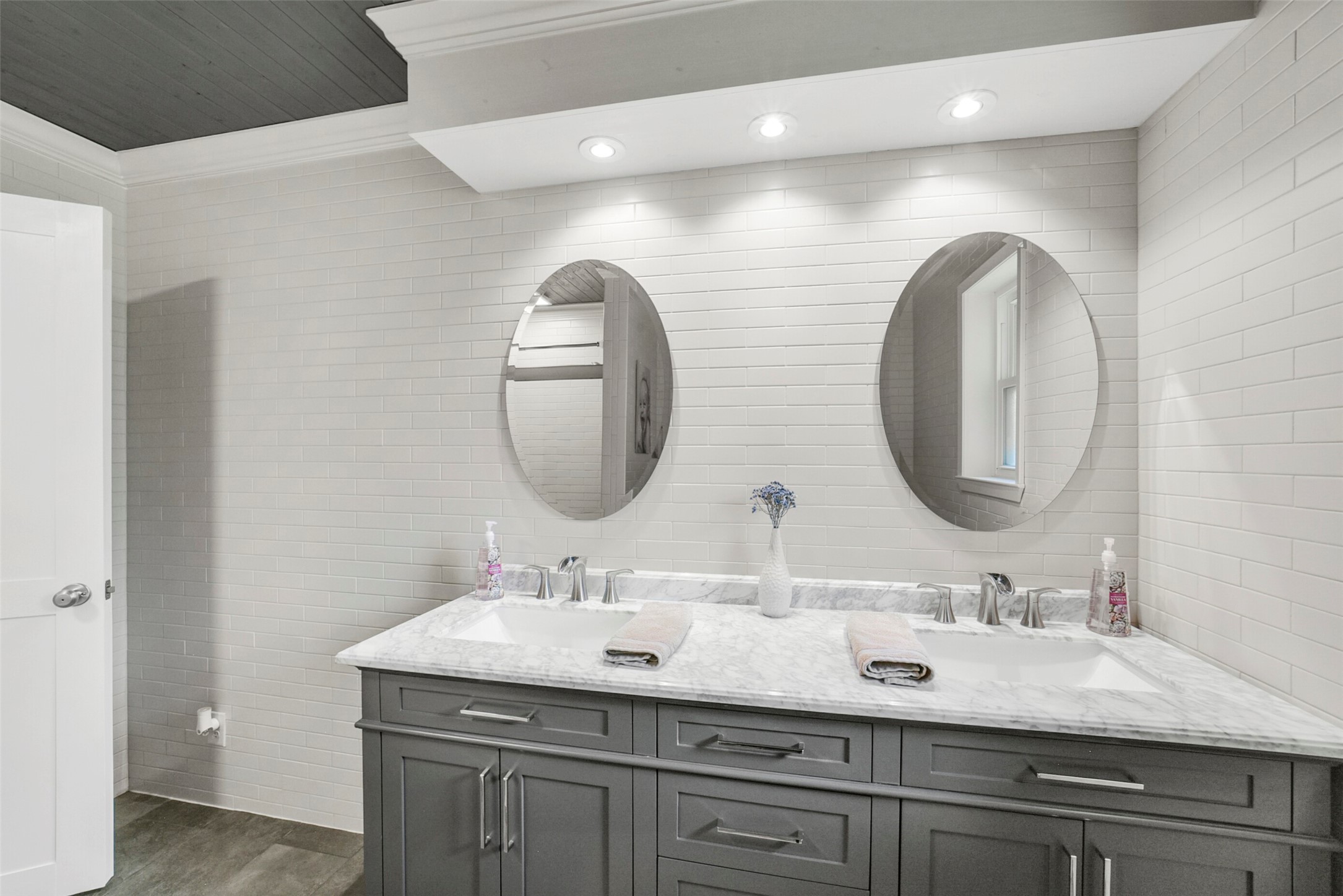 10313 South Williams Road Conroe, TX 77303 - Photo 32 of 48 Hall bathroom vanity and double sink and mirrors.