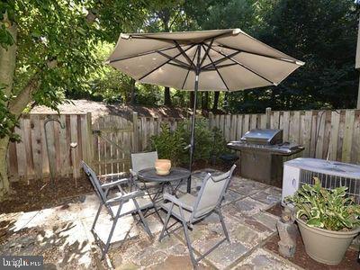 11019 Thrush Ridge Road Reston, VA 20191 - Photo 12 of 28 a view of a backyard with sitting area and furniture