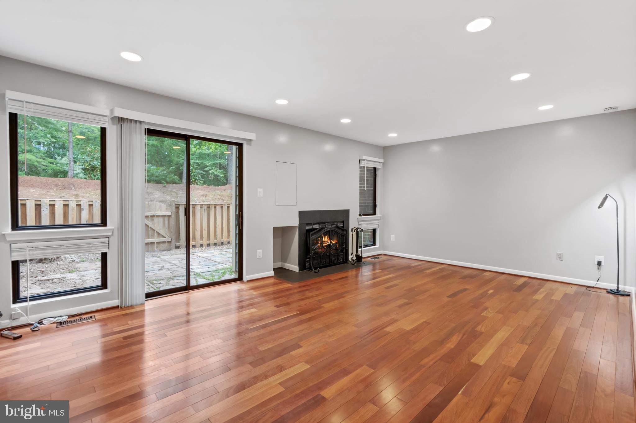 11019 Thrush Ridge Road Reston, VA 20191 - Photo 14 of 28 a view of empty room with wooden floor and fireplace
