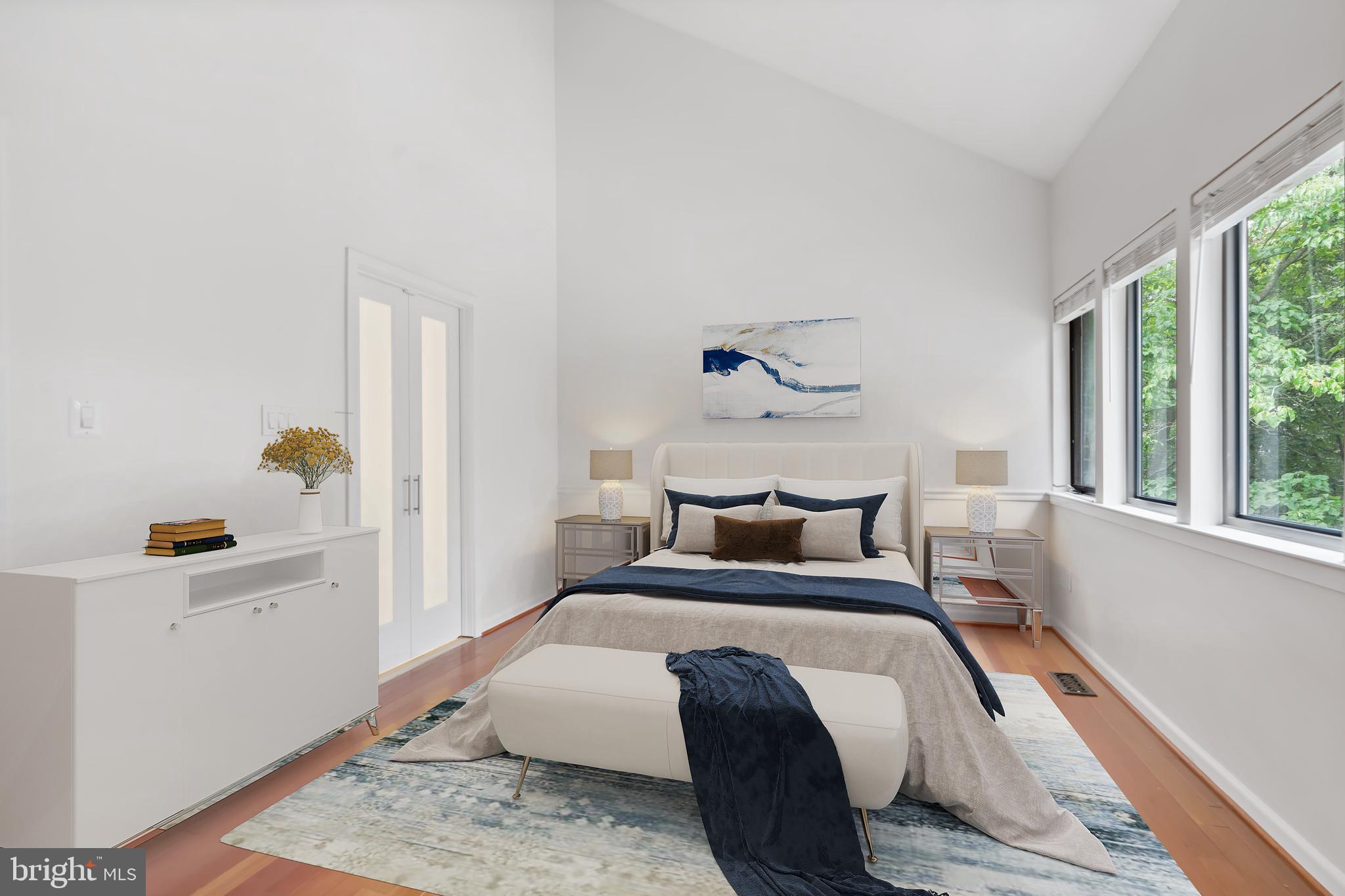 11019 Thrush Ridge Road Reston, VA 20191 - Photo 15 of 28 a bedroom with a bed and wooden floor