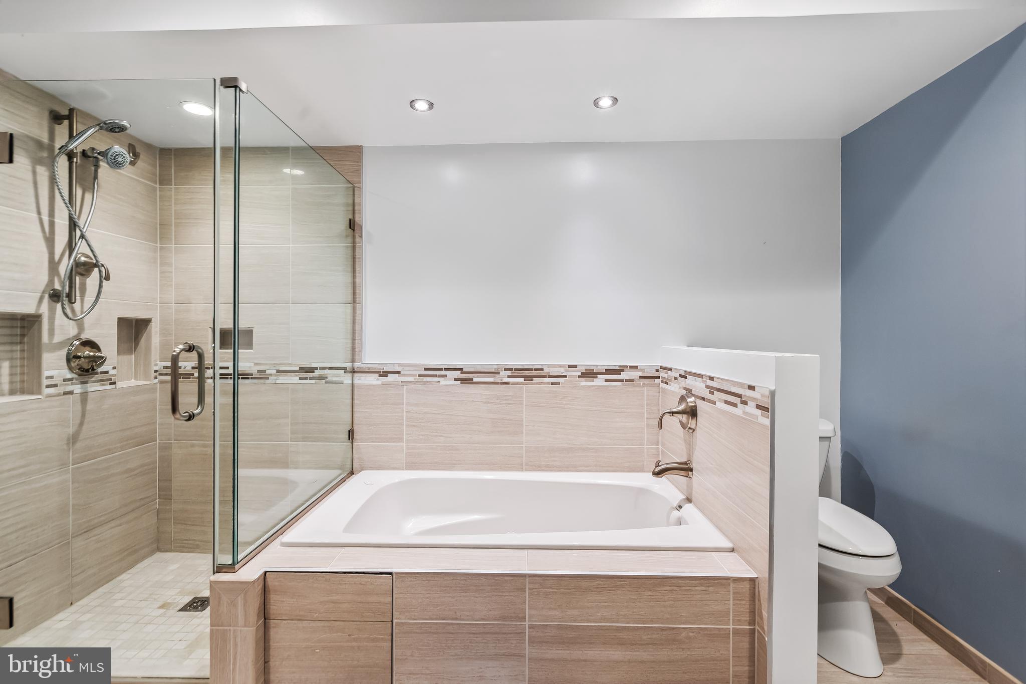 11019 Thrush Ridge Road Reston, VA 20191 - Photo 19 of 28 a bathroom with a sink a toilet and shower