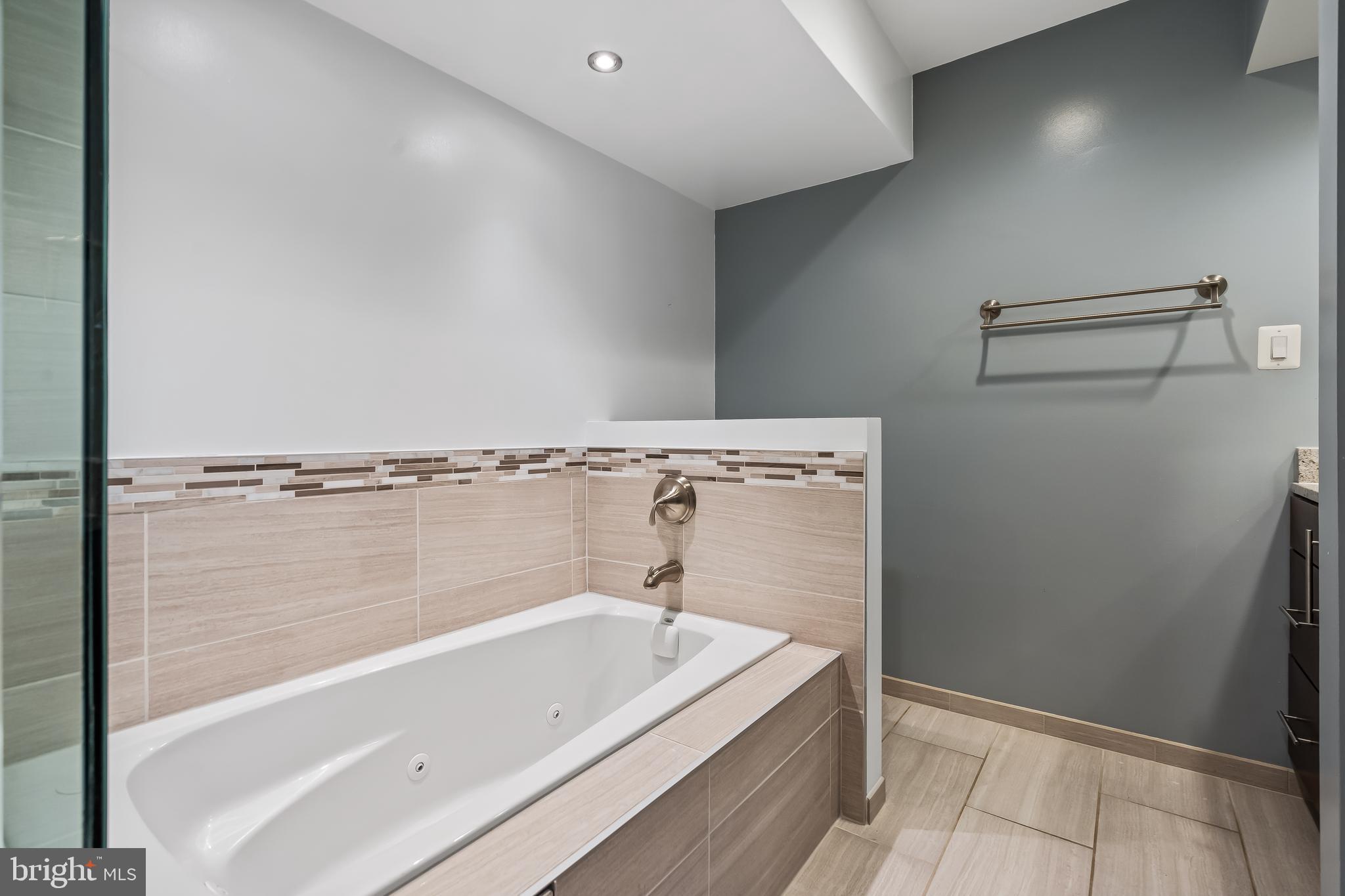 11019 Thrush Ridge Road Reston, VA 20191 - Photo 21 of 28 a bathroom with a bathtub and shower