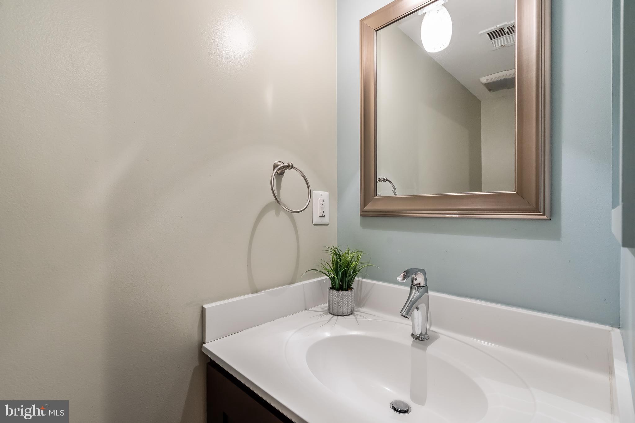11019 Thrush Ridge Road Reston, VA 20191 - Photo 24 of 28 a bathroom with a sink and a mirror