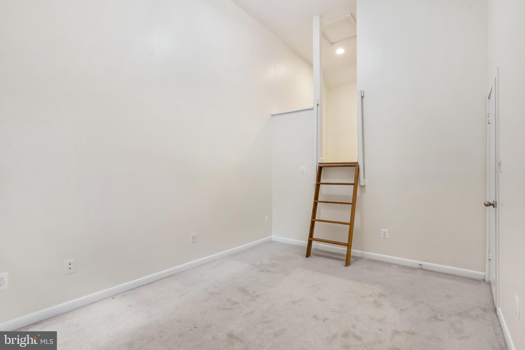 11019 Thrush Ridge Road Reston, VA 20191 - Photo 26 of 28 an empty room with a white cabinet and a window
