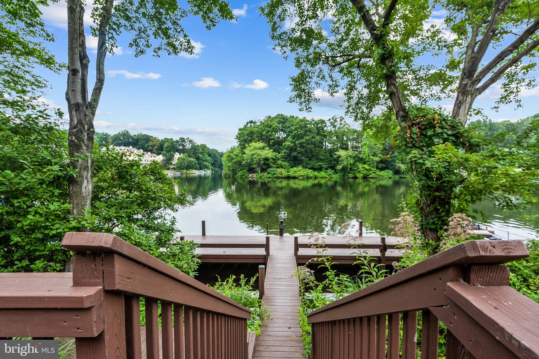 11019 Thrush Ridge Road Reston, VA 20191 - Photo 3 of 28 a view of a roof deck with wooden fence and floor