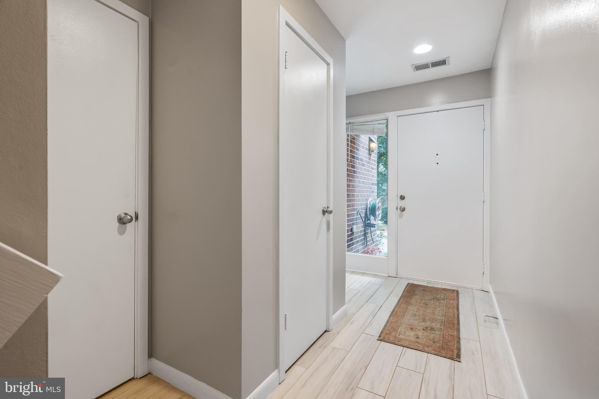 11019 Thrush Ridge Road Reston, VA 20191 - Photo 5 of 28 a view of a hallway with wooden floor and staircase