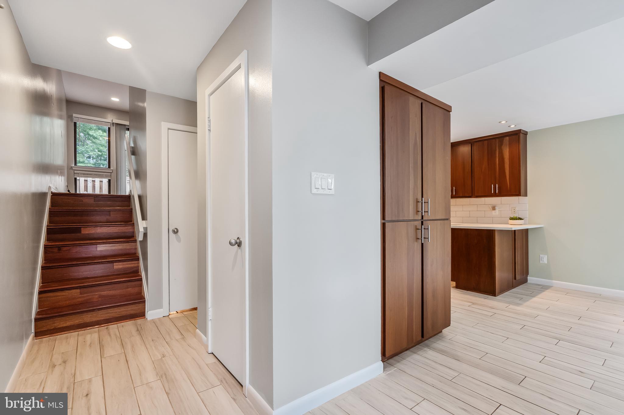11019 Thrush Ridge Road Reston, VA 20191 - Photo 6 of 28 a view of a hallway with wooden floor and cabinet