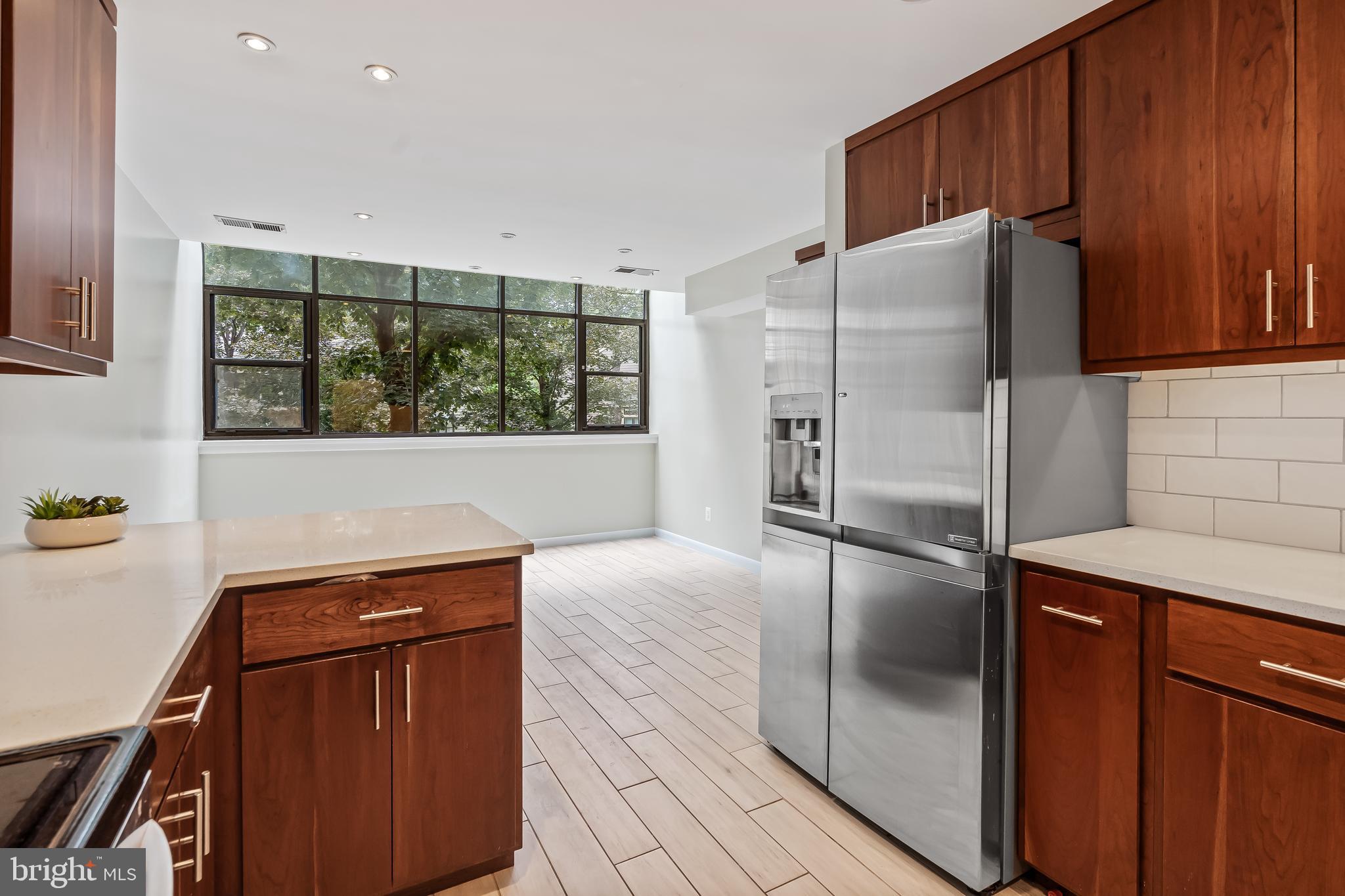 11019 Thrush Ridge Road Reston, VA 20191 - Photo 9 of 28 a kitchen with stainless steel appliances granite countertop a refrigerator and a stove