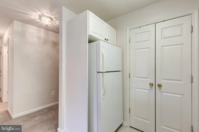 a bathroom with a shower and a glass door