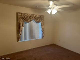 8070 West Russell Road, Unit 1057 Las Vegas, NV 89113 - Photo 3 of 10 A well-lit bedroom features plush carpeting and a ceiling fan for comfort.