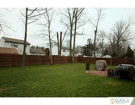 10 Meyer Road Edison, NJ 08817 - Photo 22 of 24 a view of backyard with seating area and trees