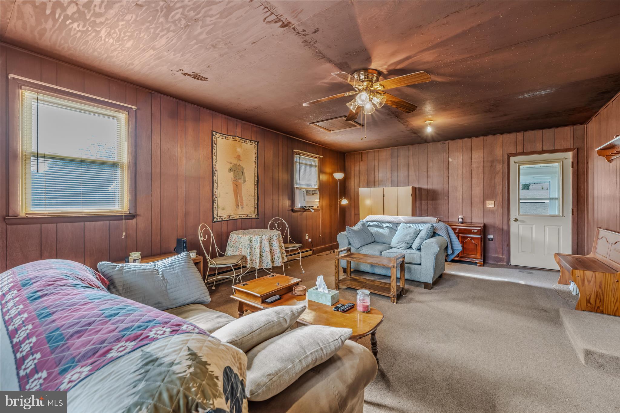 28 Gray Ridge Lane Berkeley Springs, WV 25411 - Photo 14 of 46 a bedroom with furniture and a large window