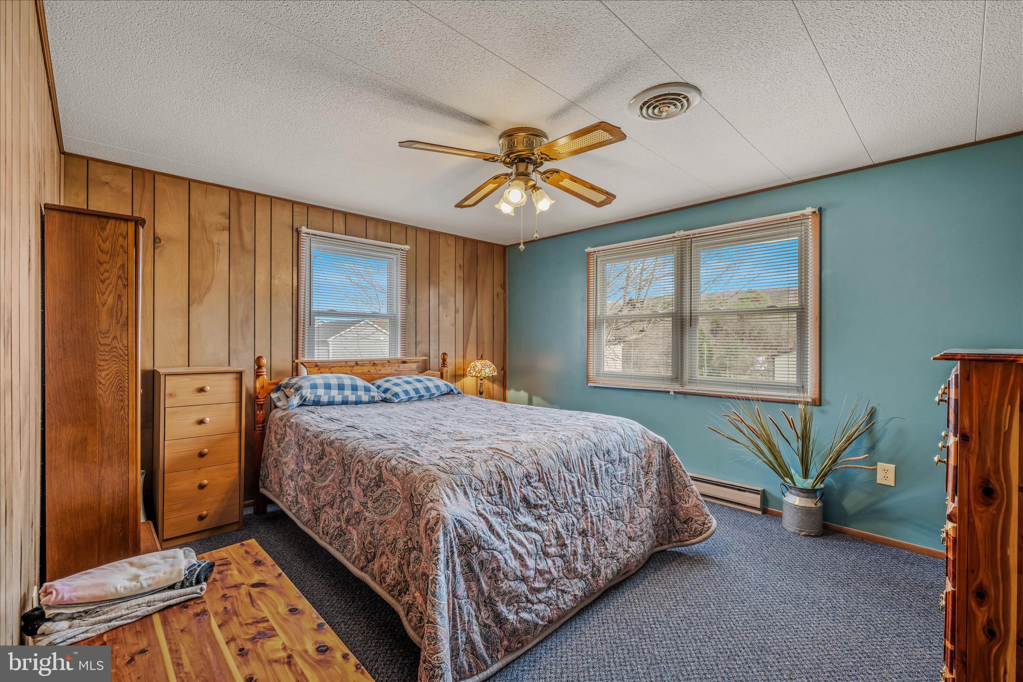 28 Gray Ridge Lane Berkeley Springs, WV 25411 - Photo 18 of 46 a bedroom with a bed and a chandelier