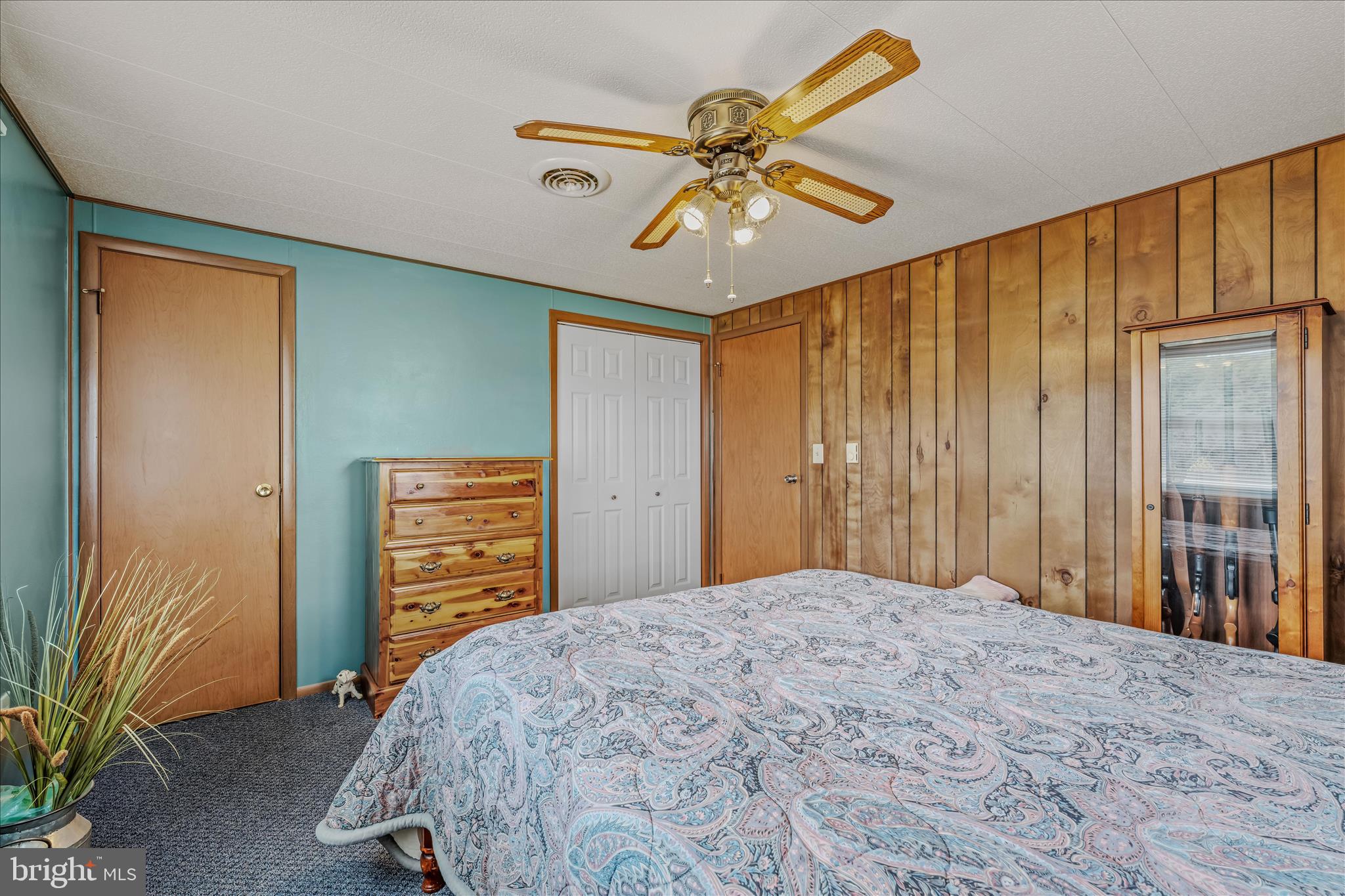 28 Gray Ridge Lane Berkeley Springs, WV 25411 - Photo 19 of 46 a bedroom with a bed and a chandelier