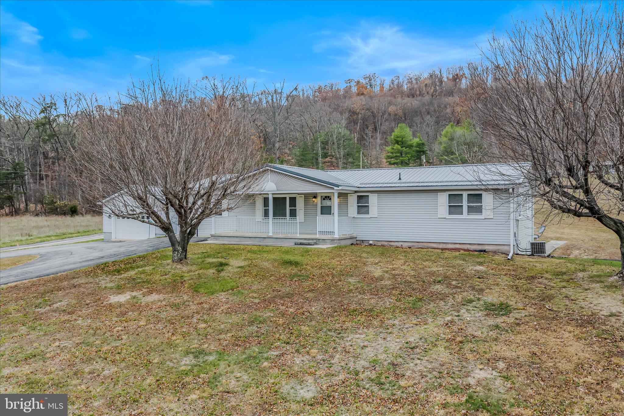 28 Gray Ridge Lane Berkeley Springs, WV 25411 - Photo 2 of 46 a view of a house with a yard