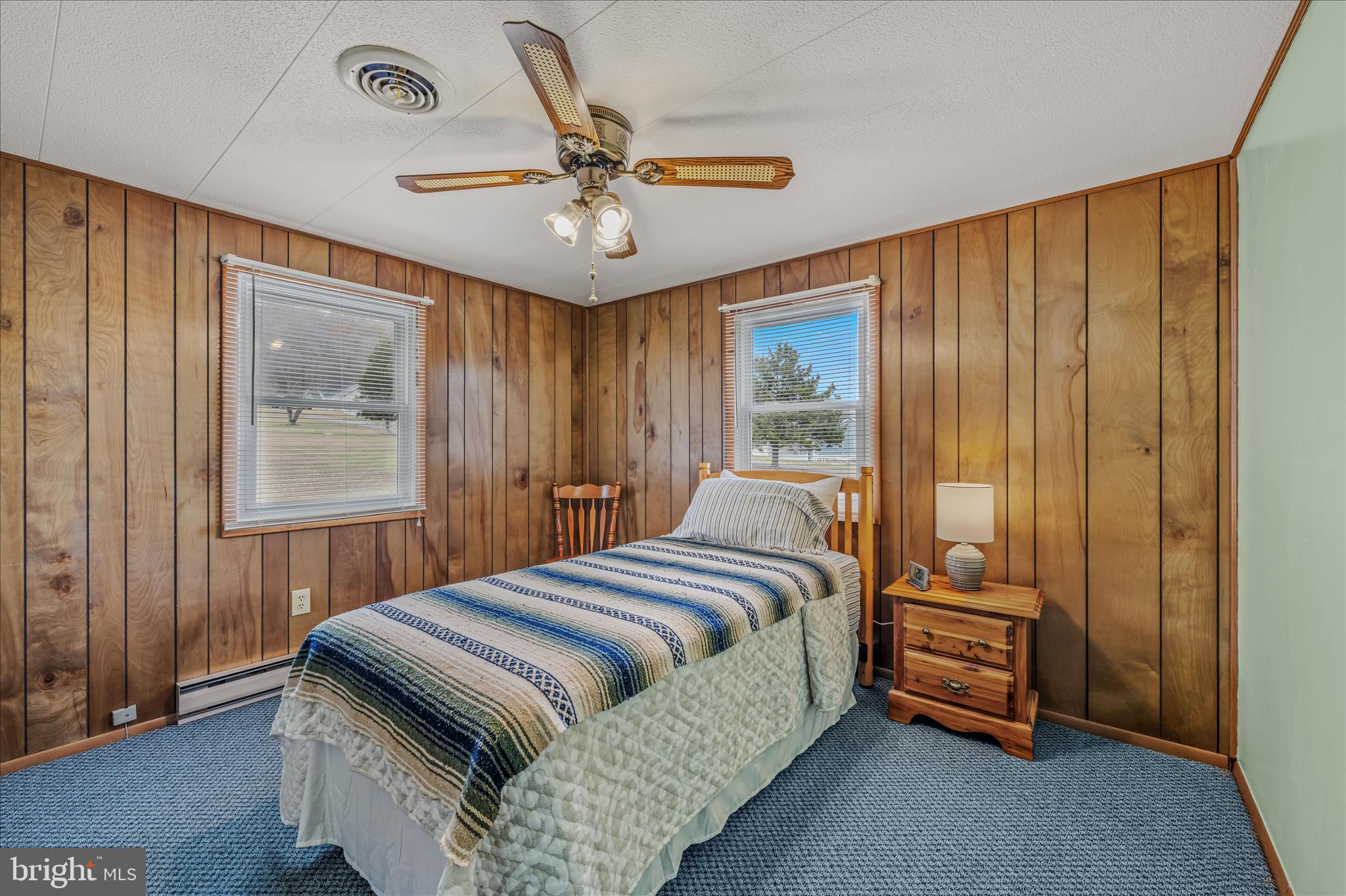 28 Gray Ridge Lane Berkeley Springs, WV 25411 - Photo 22 of 46 a bedroom with a bed and a chandelier