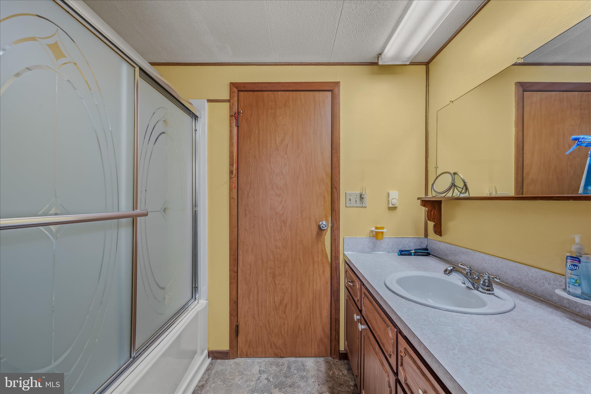 28 Gray Ridge Lane Berkeley Springs, WV 25411 - Photo 24 of 46 a bathroom with a granite countertop sink and a mirror