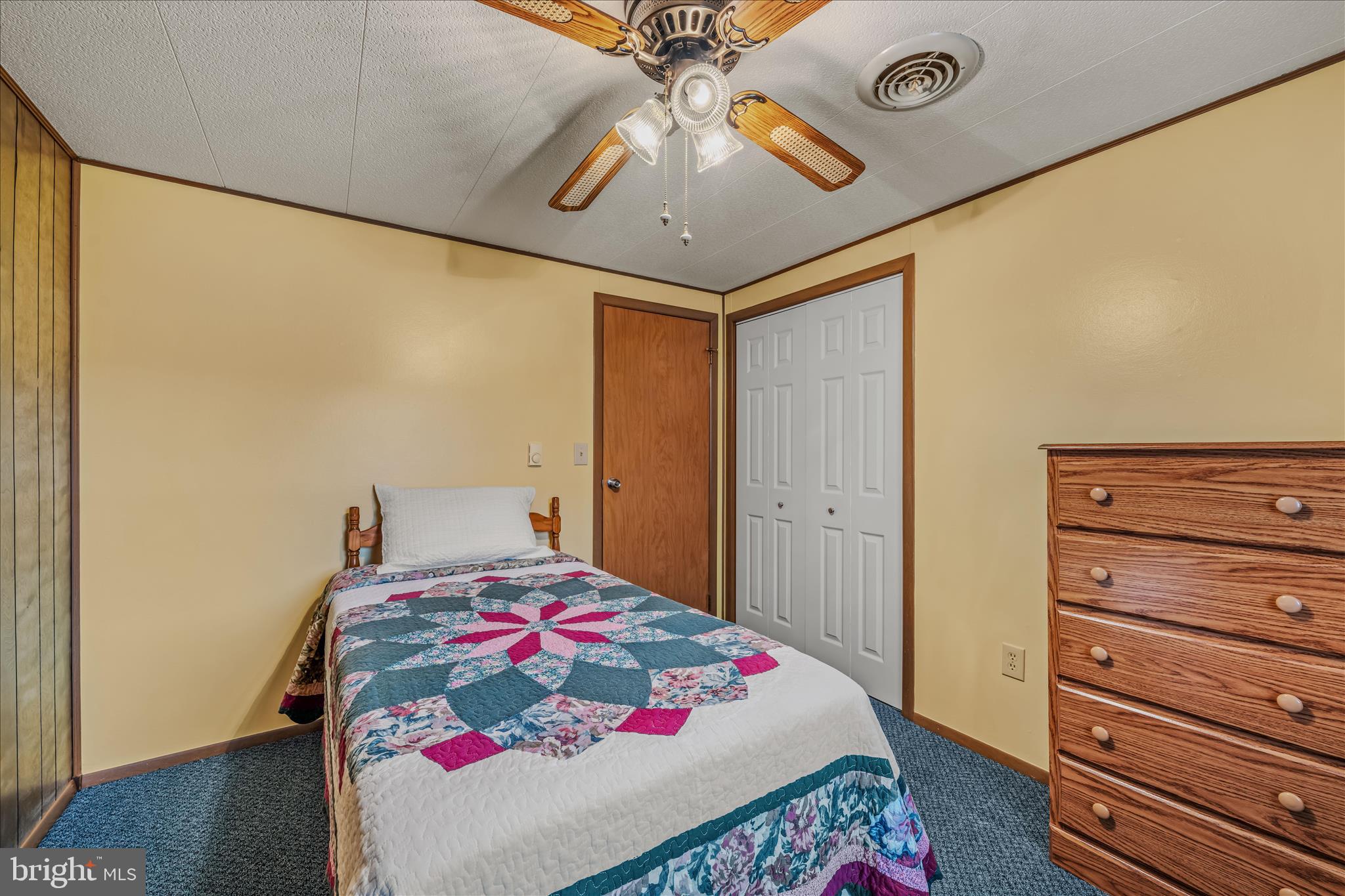 28 Gray Ridge Lane Berkeley Springs, WV 25411 - Photo 26 of 46 a bedroom with a bed and a dresser