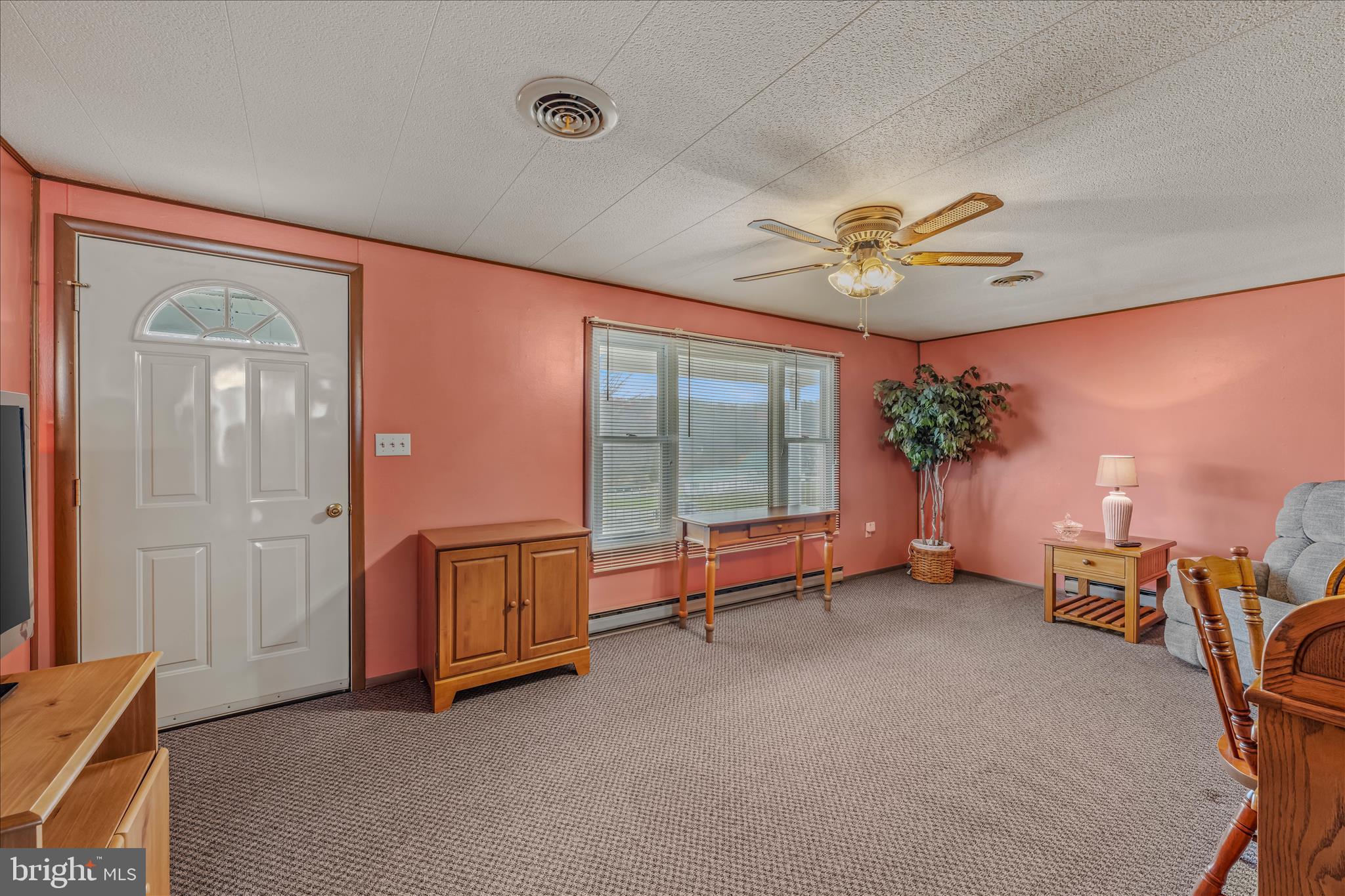 28 Gray Ridge Lane Berkeley Springs, WV 25411 - Photo 8 of 46 a view of a livingroom with furniture and a ceiling fan
