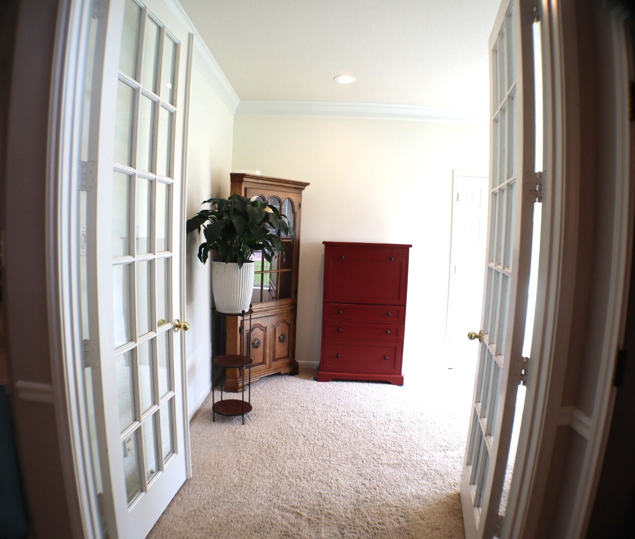 19114 Emory Trail Spring, TX 77388 - Photo 7 of 32 This office features French doors, a cozy carpeted floor, and a neutral color scheme. It includes large windows providing natural light creating a warm and inviting atmosphere.