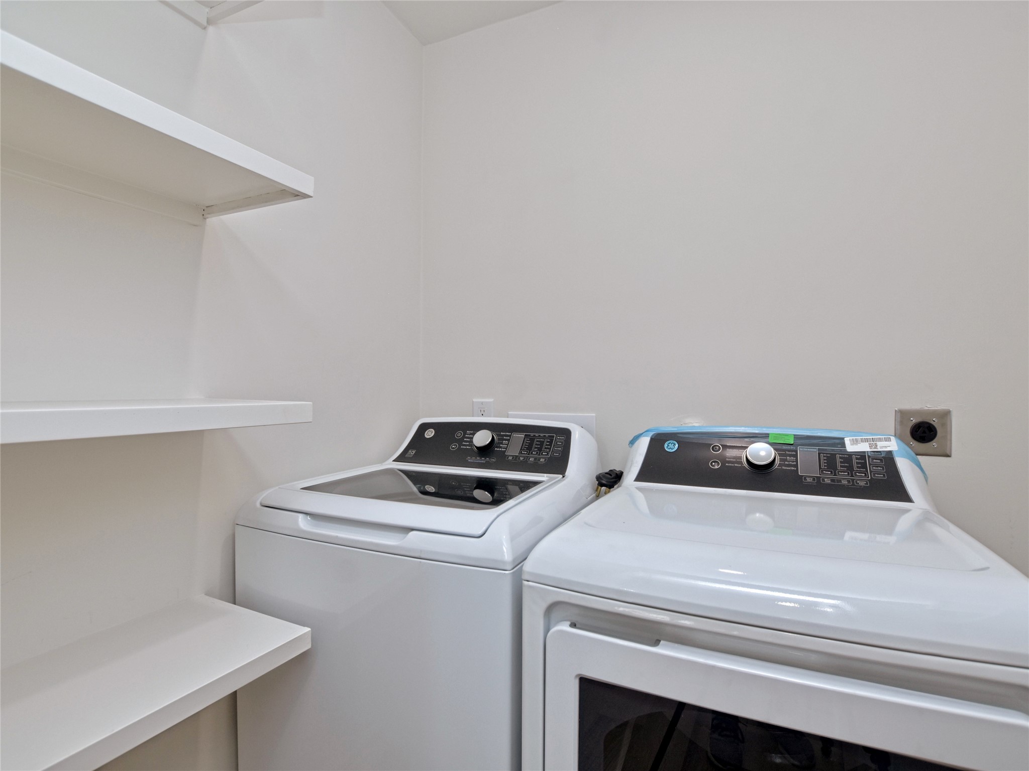 5903 Gateshead Drive Austin, TX 78745 - Photo 21 of 26 a utility room with dryer and washer