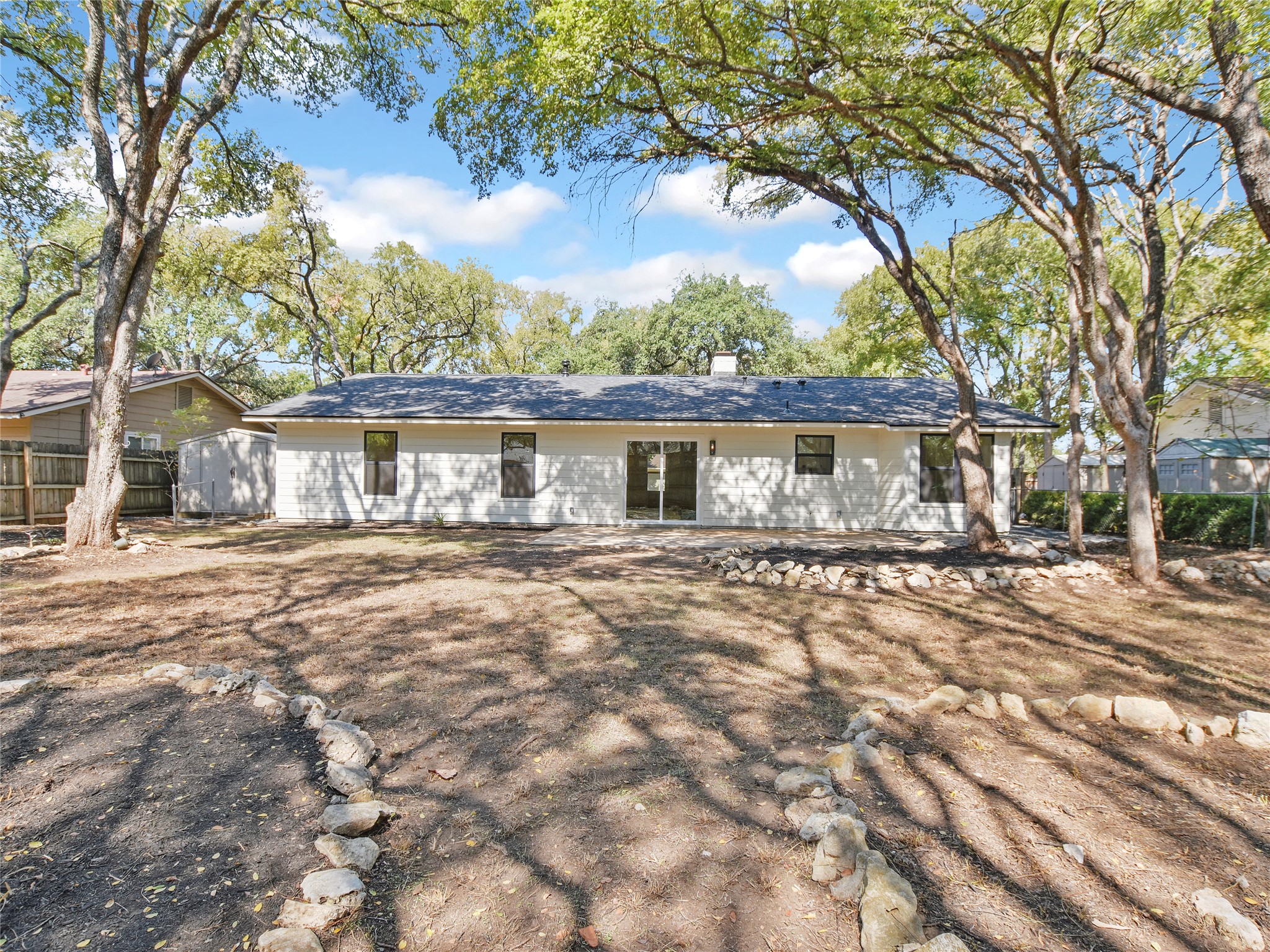 5903 Gateshead Drive Austin, TX 78745 - Photo 23 of 26 a front view of a house with a yard