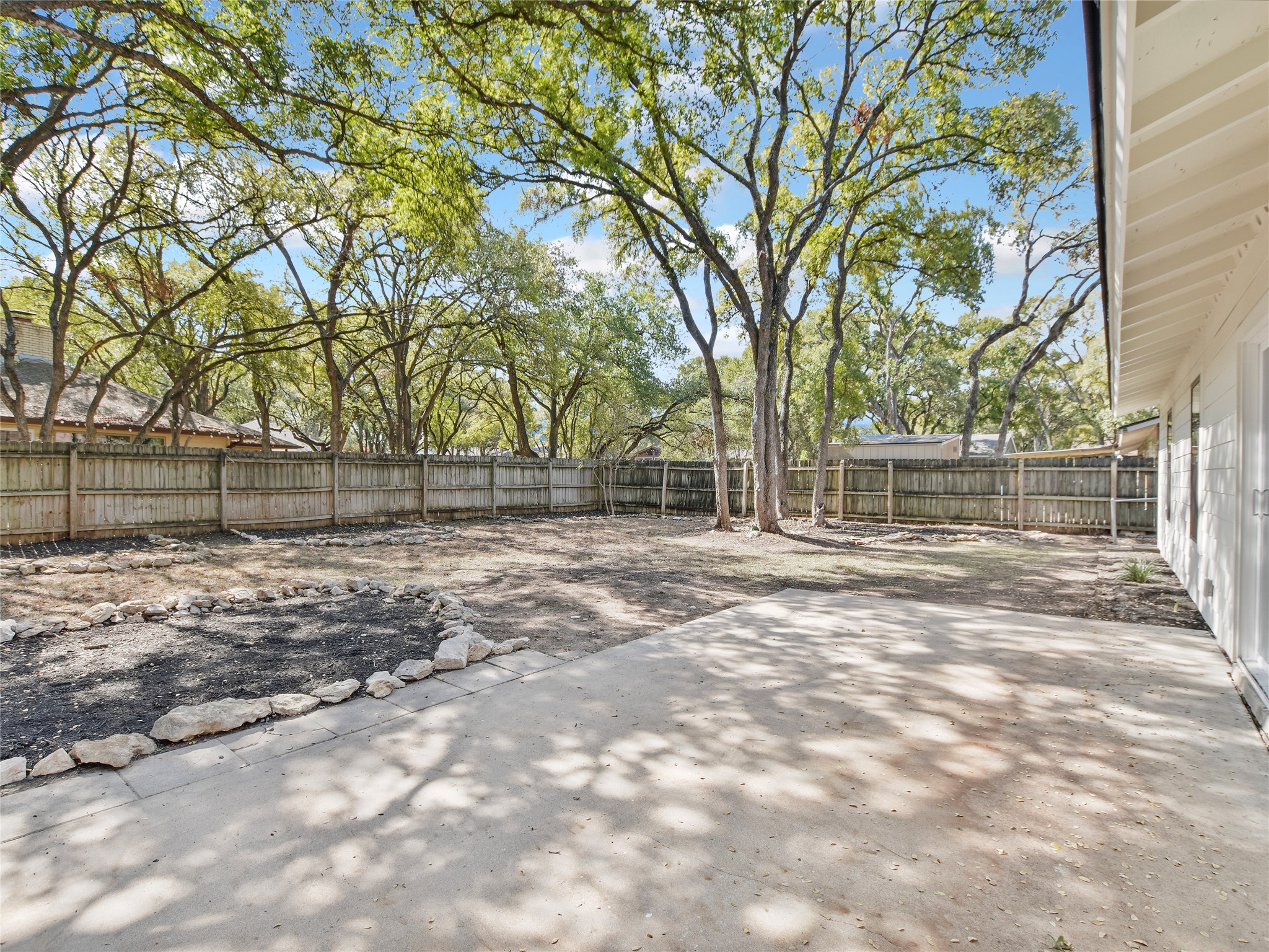 5903 Gateshead Drive Austin, TX 78745 - Photo 24 of 26 a view of a yard with large trees