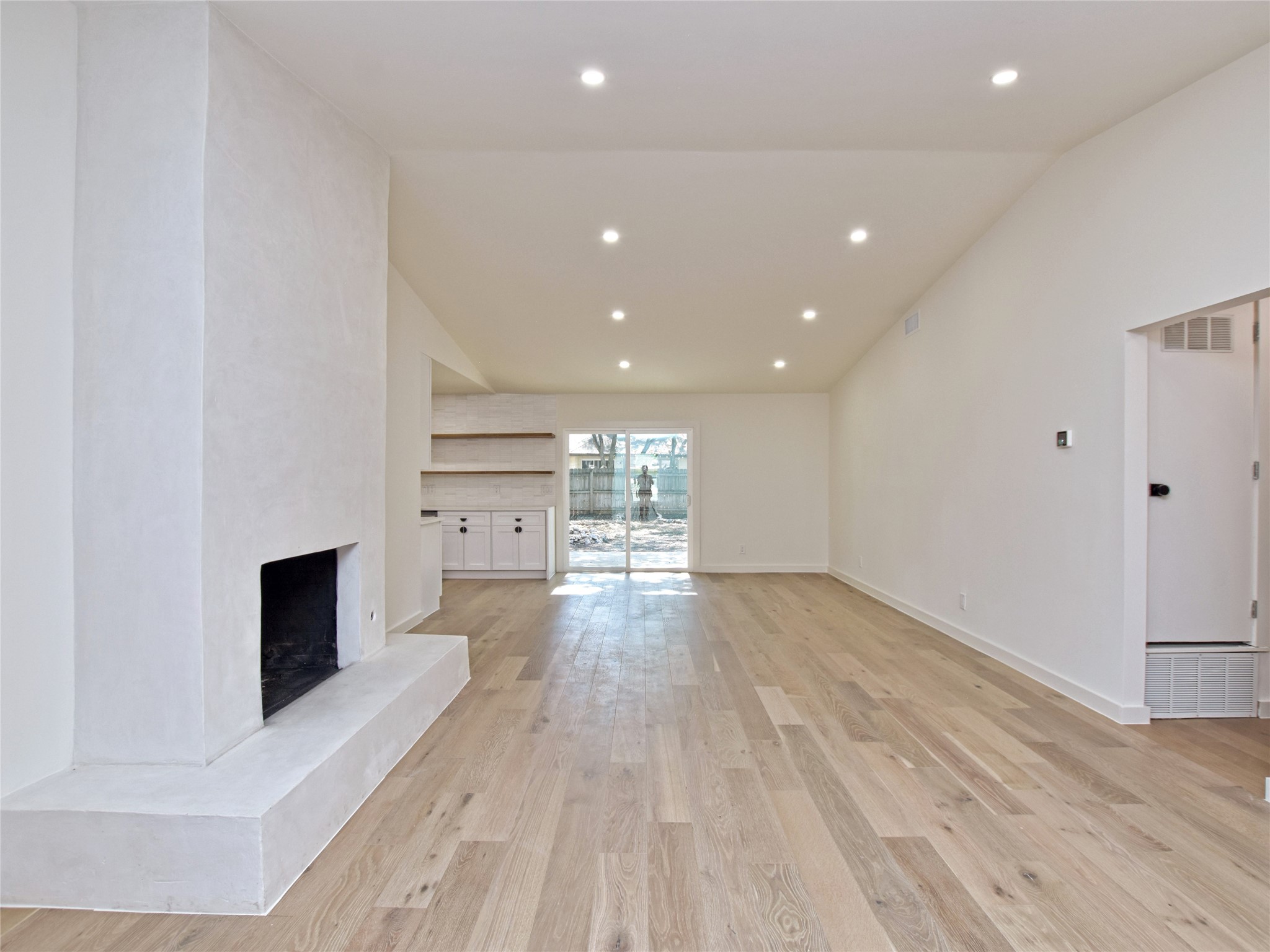 5903 Gateshead Drive Austin, TX 78745 - Photo 4 of 26 a view of empty room with wooden floor and fireplace