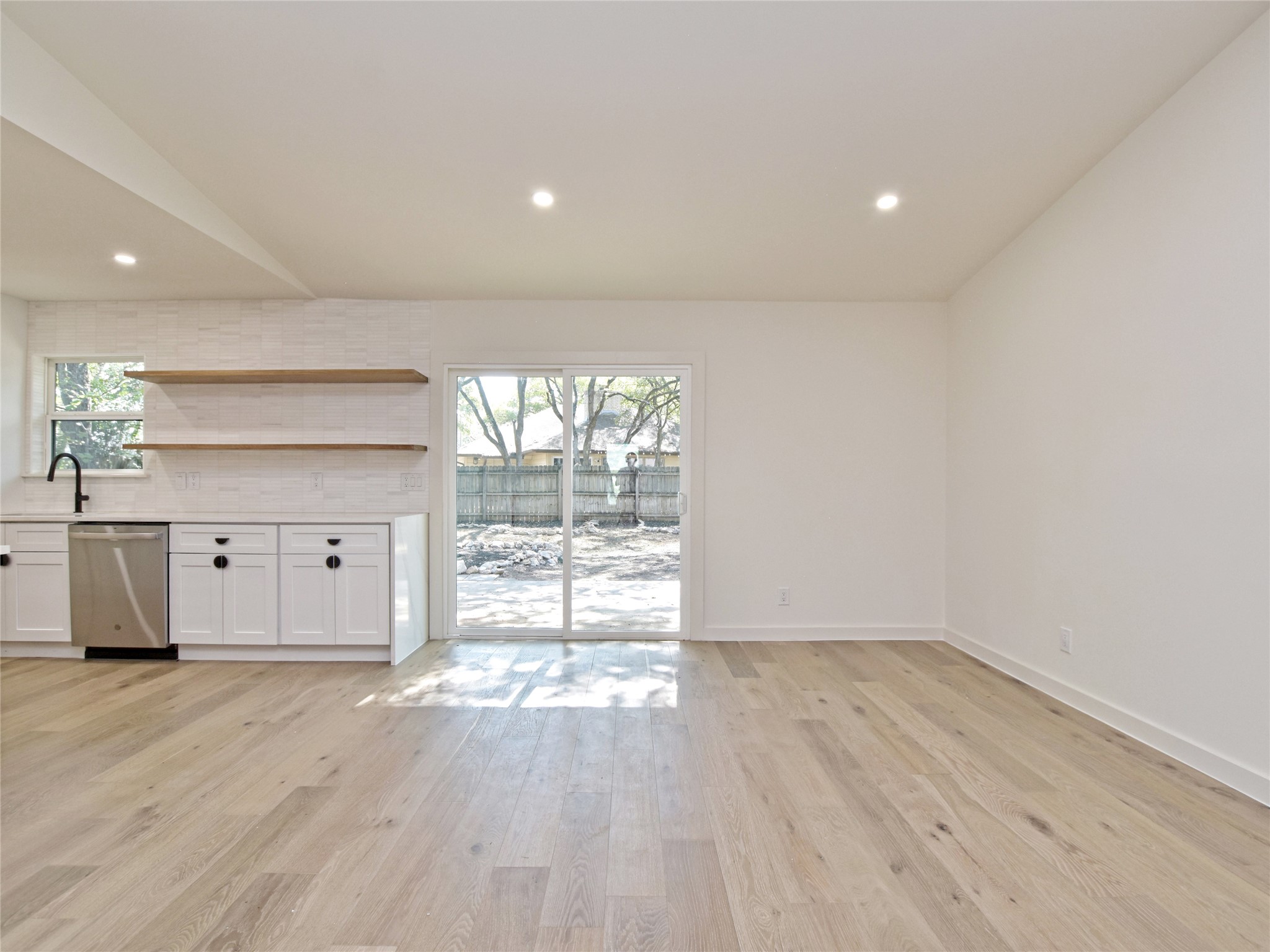 5903 Gateshead Drive Austin, TX 78745 - Photo 6 of 26 an empty room with wooden floor and windows
