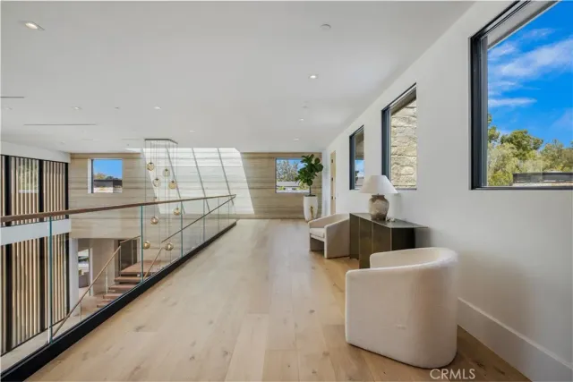 a large living room with stainless steel appliances