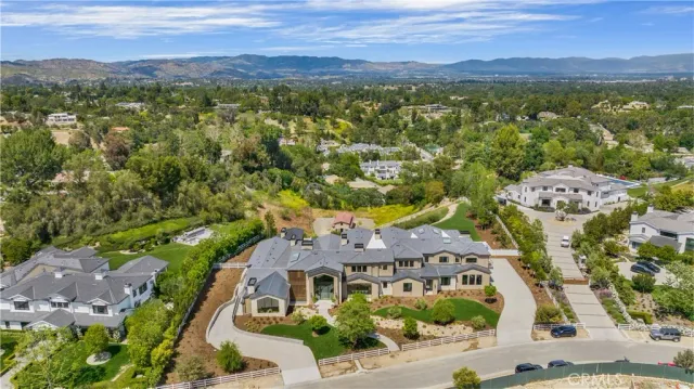an aerial view of residential house with outdoor space and mountain view