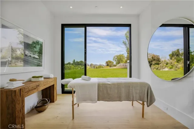 a bedroom with a bed and a view of bathroom