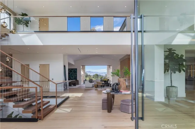 a view of a living room and entry way