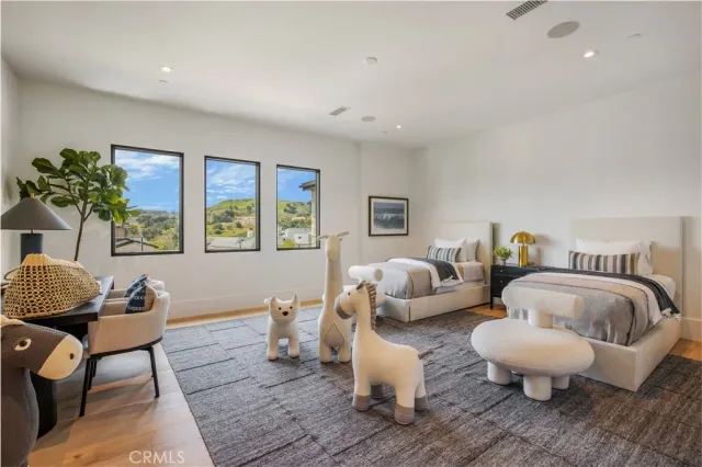 a bathroom with a sink mirror and a bathtub