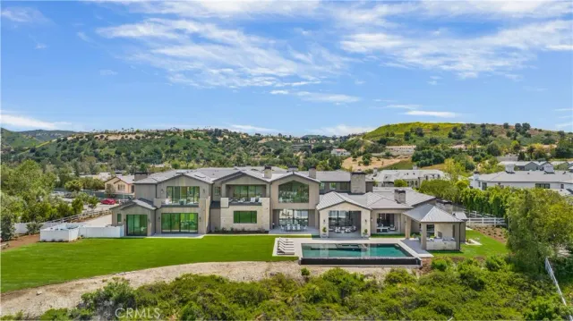 a view of swimming pool and mountain in the background