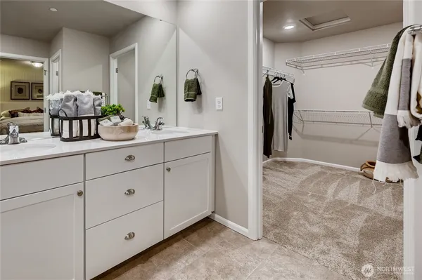 a bathroom with a double vanity sink and mirror