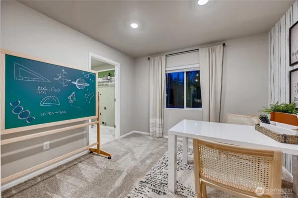 a room with pool table and windows