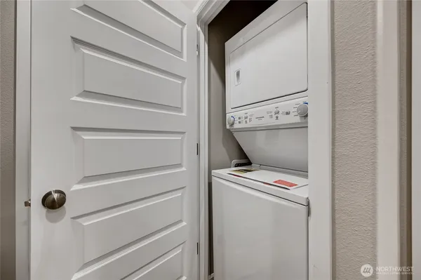 a view of storage and utility room with washer and dryer