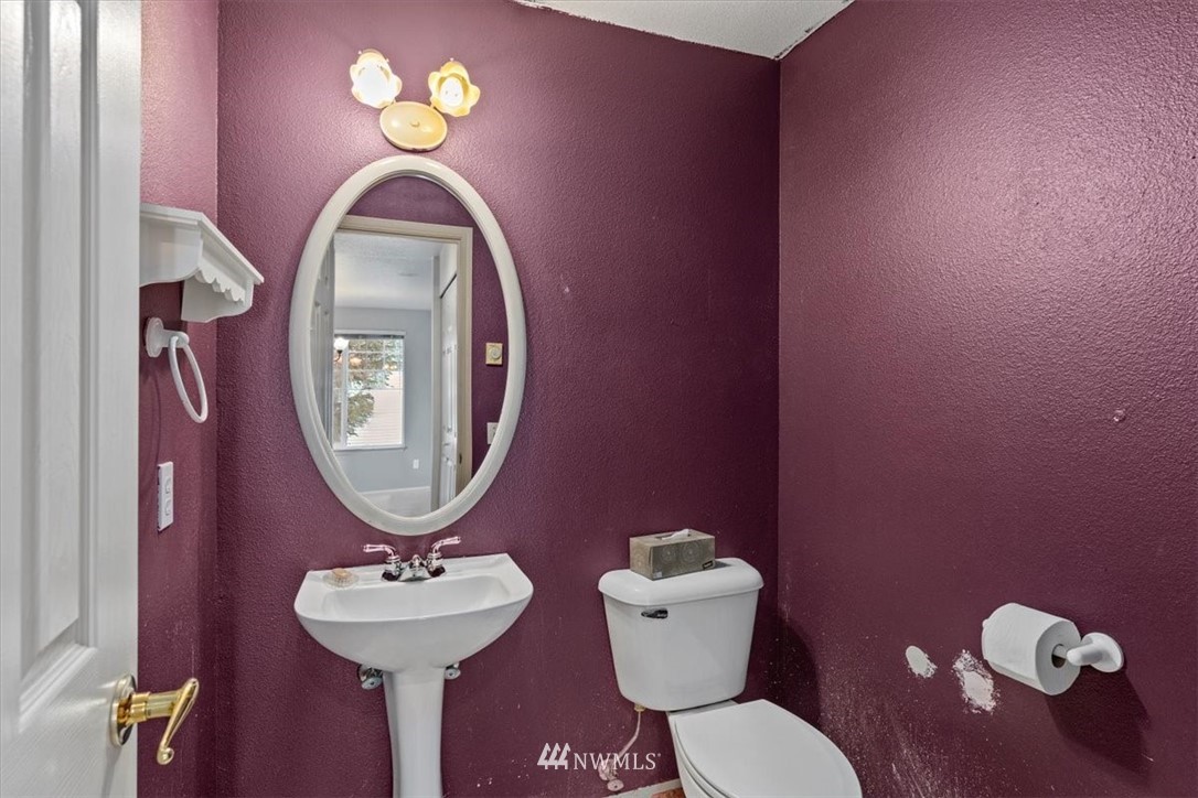 1160 Monroe Avenue Northeast, Unit B1 Renton, WA 98056 - Photo 16 of 24 a bathroom with a toilet sink and mirror