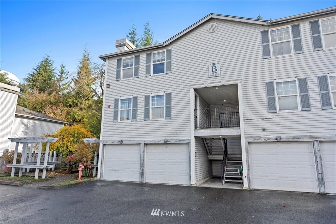 1160 Monroe Avenue Northeast, Unit B1 Renton, WA 98056 - Photo 6 of 24 a view of a house with a yard
