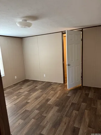a bathroom with a granite countertop bathtub shower sink and toilet