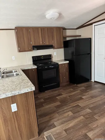 a view of kitchen with wooden floor
